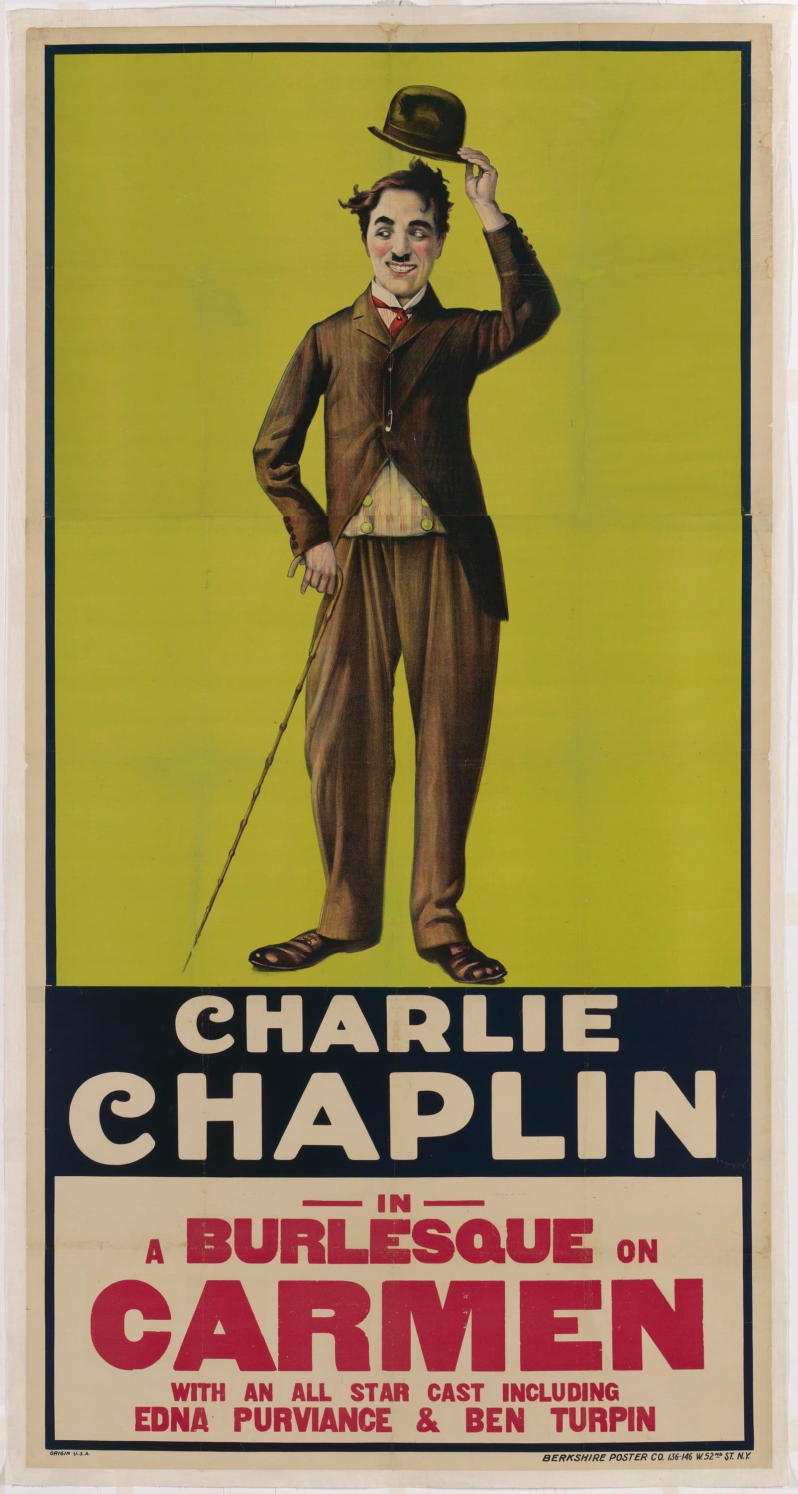 Charlie Chaplin as the Tramp tips his bowler hat against a chartreuse background above bold red and blue lettering for Carmen.